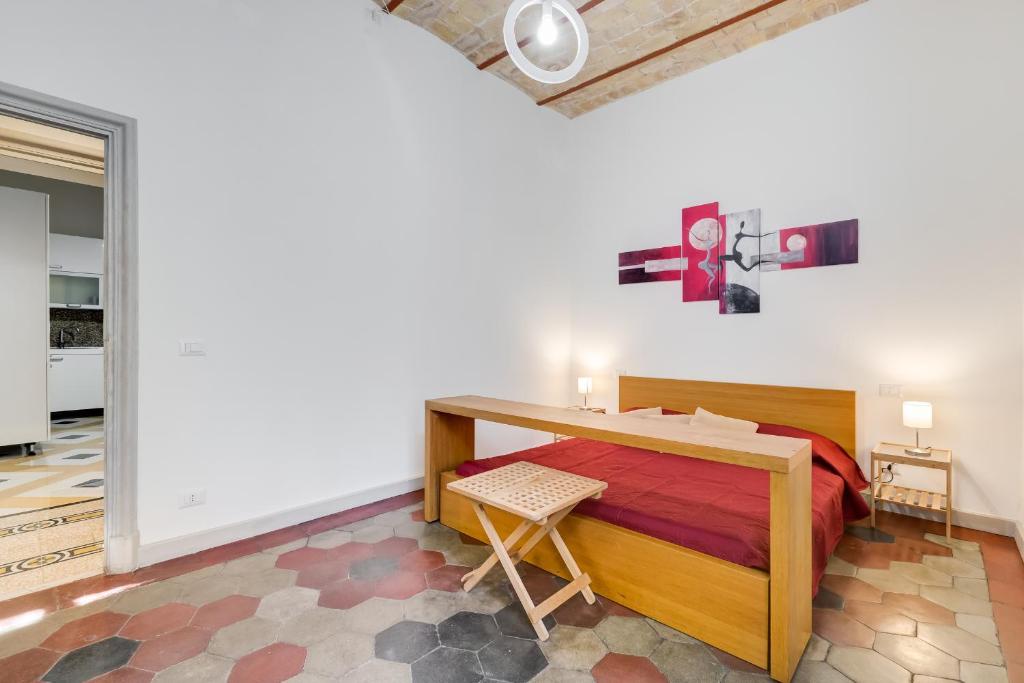 Łóżko lub łóżka w pokoju w obiekcie Monti Colosseum apartment