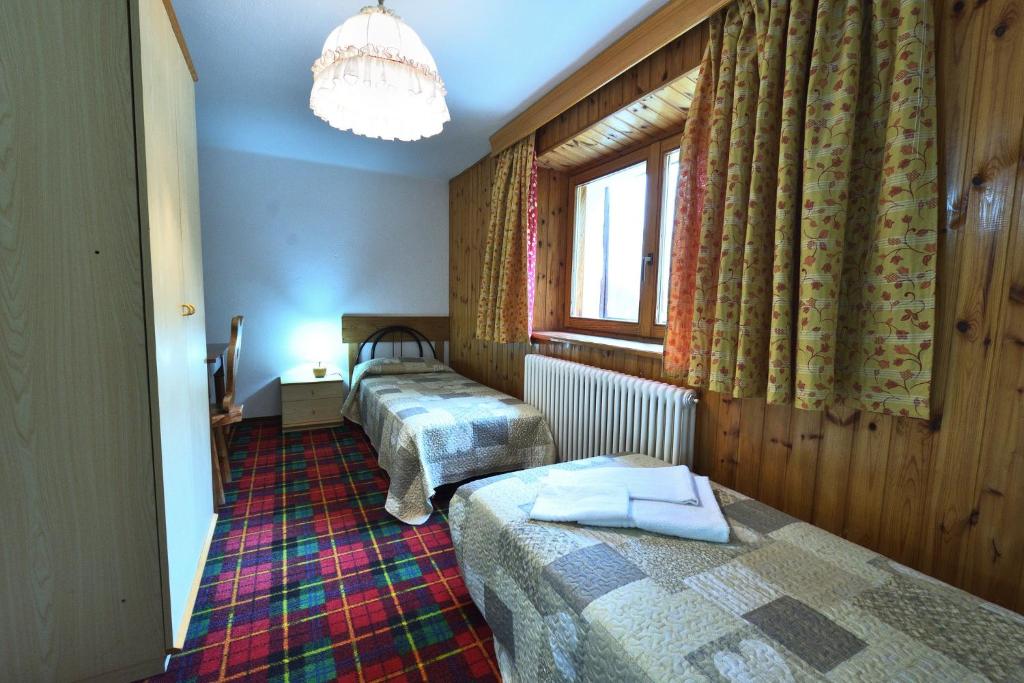 Postel nebo postele na pokoji v ubytování Hotel Paradisia