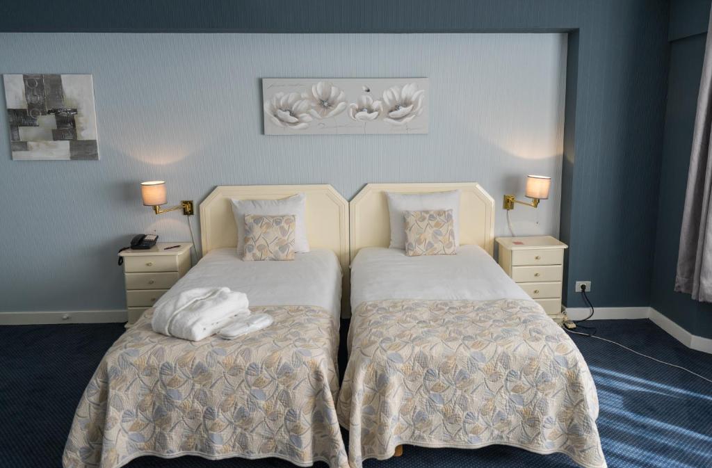 Postel nebo postele na pokoji v ubytování First Euroflat Hotel