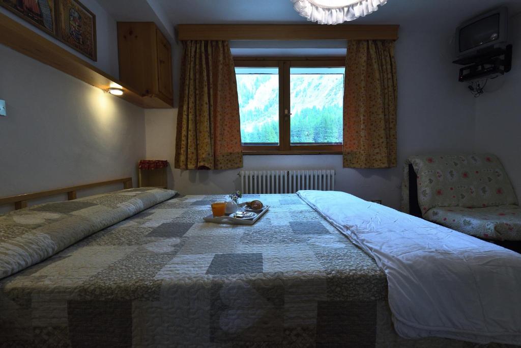 Postel nebo postele na pokoji v ubytování Hotel Paradisia