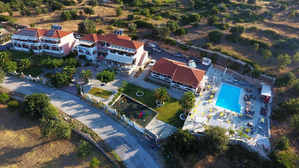 an aerial view of a house with a swimming pool at Saint George's Hotel in Nea Stira