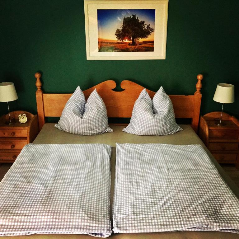 a bedroom with a bed with two white pillows at Ferienhaus Eitel in Spalt