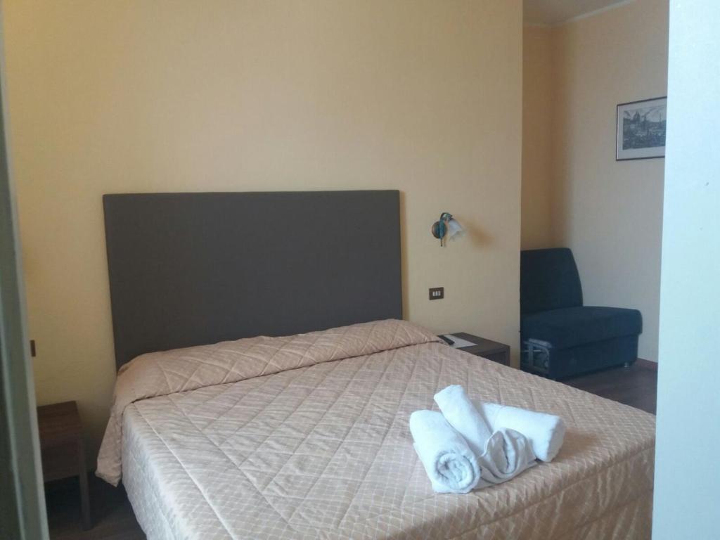 Postel nebo postele na pokoji v ubytování Hotel Lido