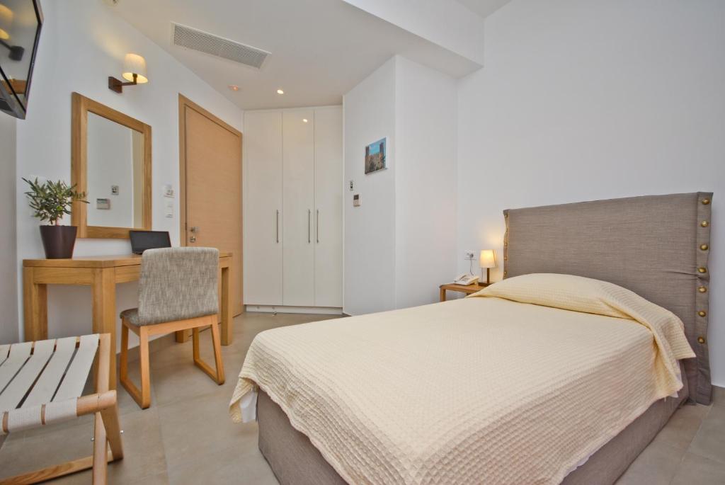 Postel nebo postele na pokoji v ubytování Xenia Hotel