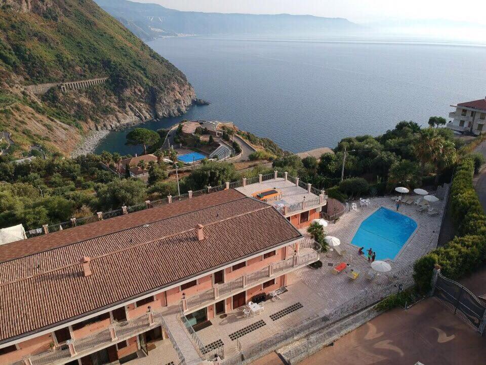 an aerial view of a building and the water at Residence La Marinella in Palmi