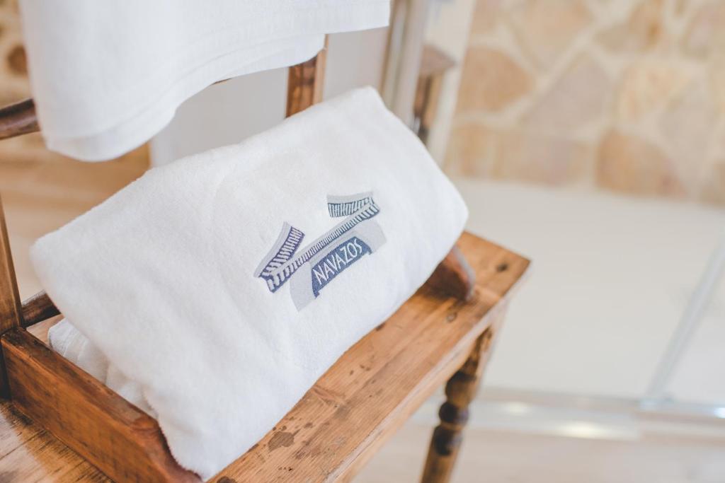 a white towel sitting on a wooden table at Navazos loft in Benaocaz