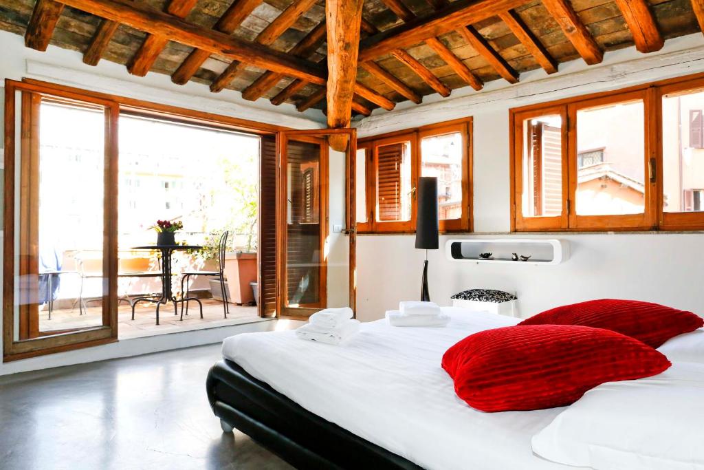 Postel nebo postele na pokoji v ubytování Suite Trastevere