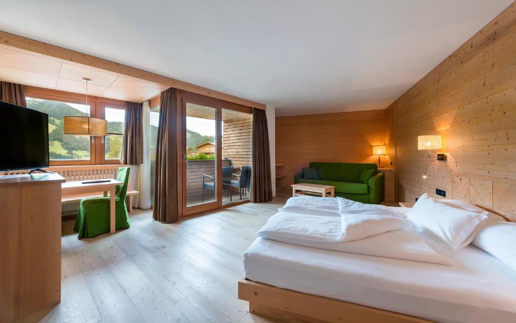 Posteľ alebo postele v izbe v ubytovaní Hotel Cavallino