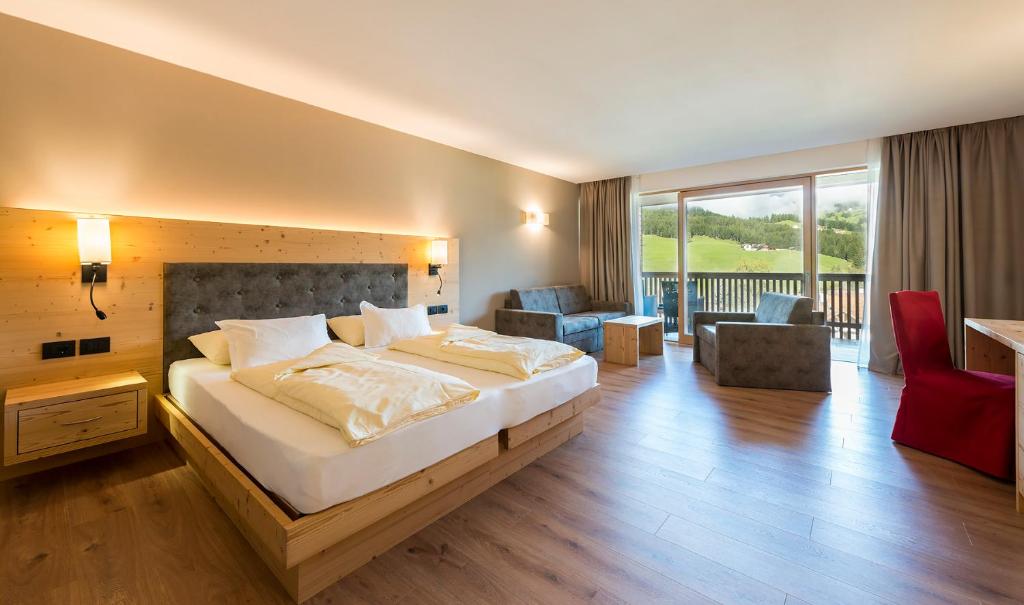 Posteľ alebo postele v izbe v ubytovaní Hotel Cavallino