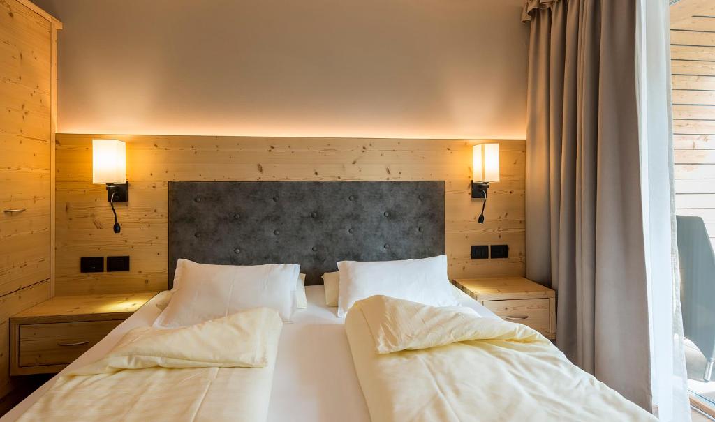 Posteľ alebo postele v izbe v ubytovaní Hotel Cavallino