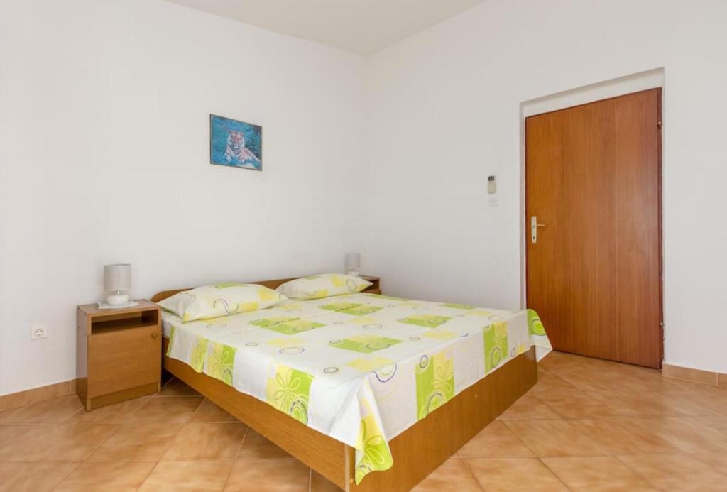 Posteľ alebo postele v izbe v ubytovaní Piscina Apartments