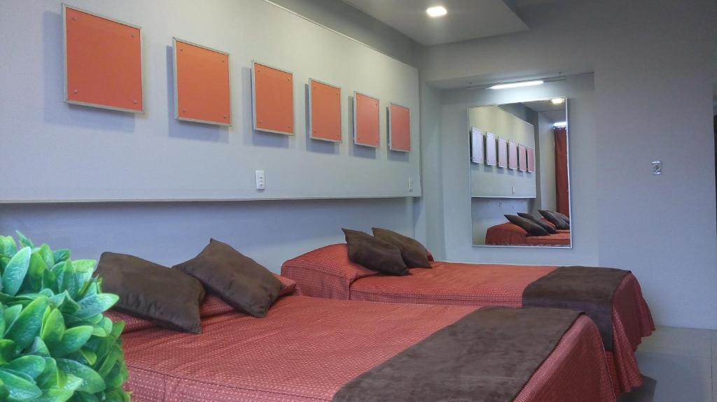 Postel nebo postele na pokoji v ubytování Hotel Cabildos