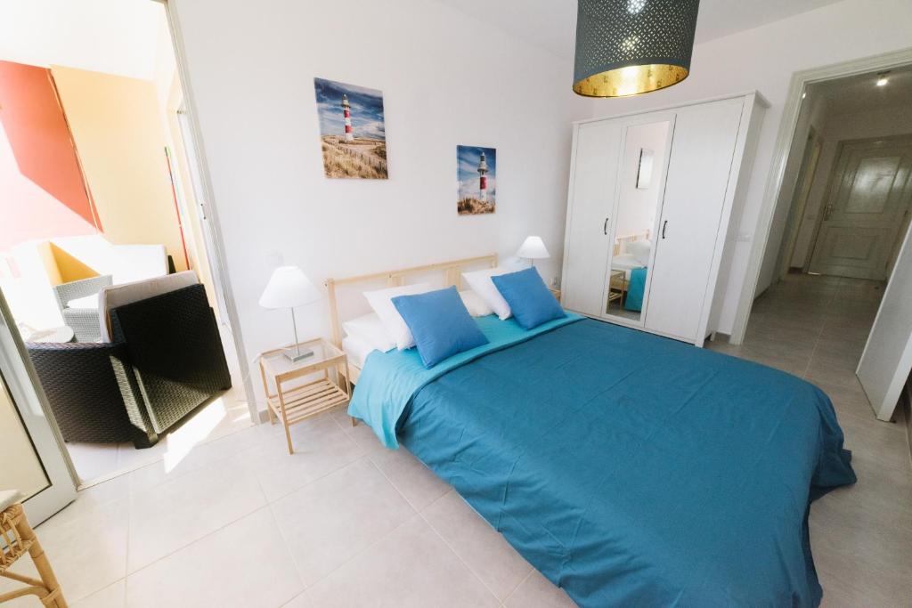Posteľ alebo postele v izbe v ubytovaní Apartamentos Ocean View