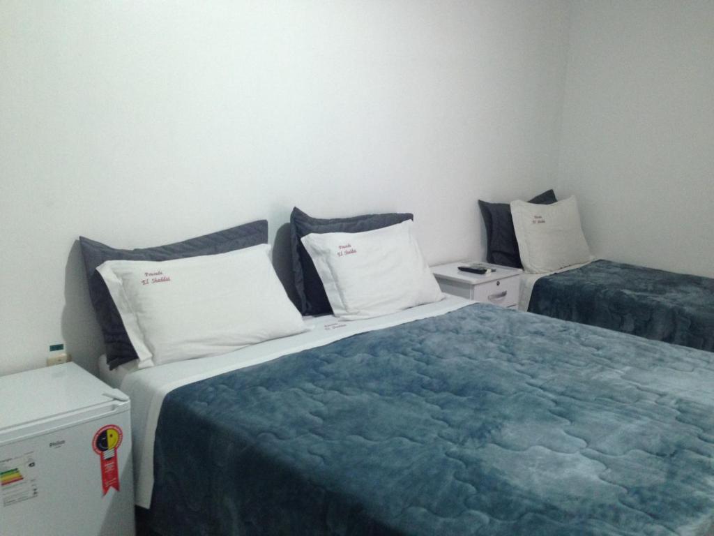 מיטה או מיטות בחדר ב-Pousada El Shaddai