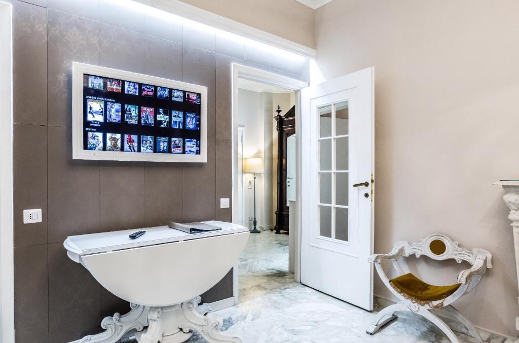 a bathroom with a white toilet and a window at Vatican Art House in Rome