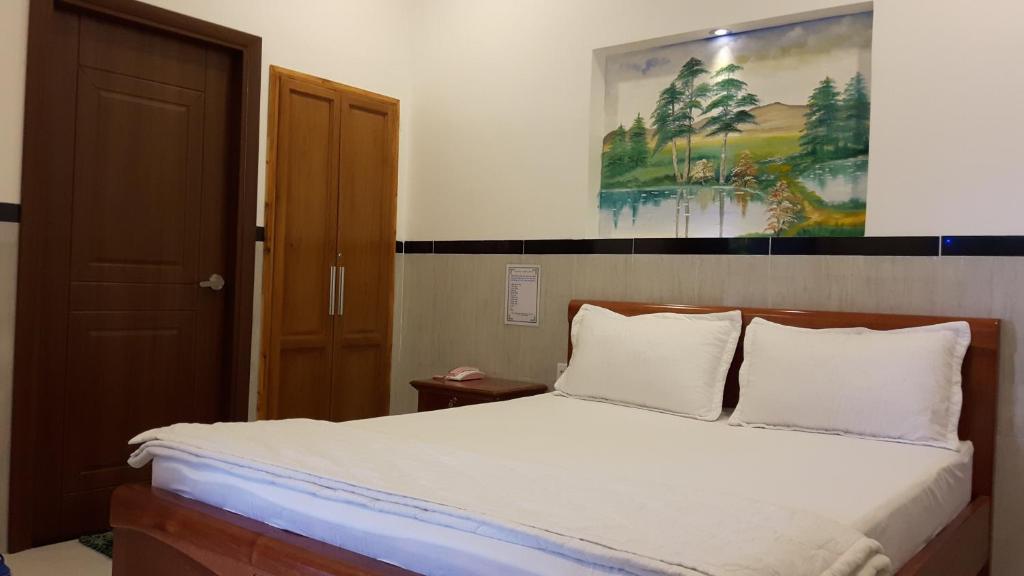 Postel nebo postele na pokoji v ubytování Motel Hoang Gia