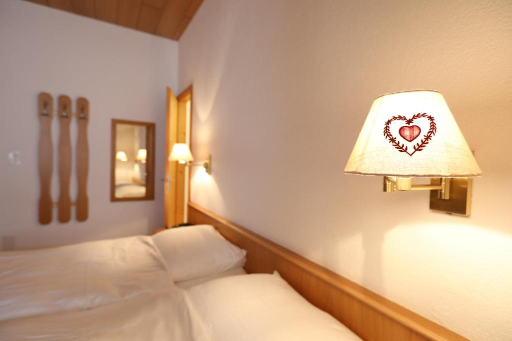 Postel nebo postele na pokoji v ubytování Hotel Concordia