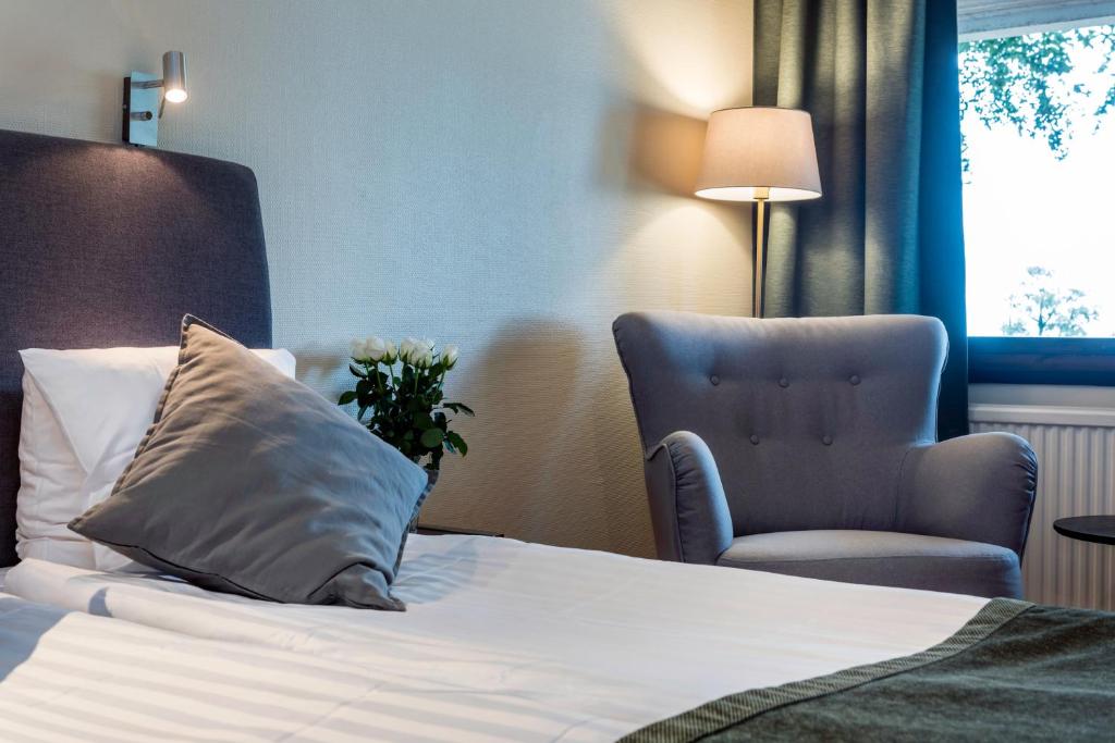 Postel nebo postele na pokoji v ubytování Hotel Bellevue
