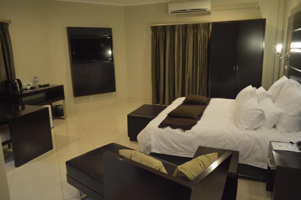 Postel nebo postele na pokoji v ubytování Hotel Amirana