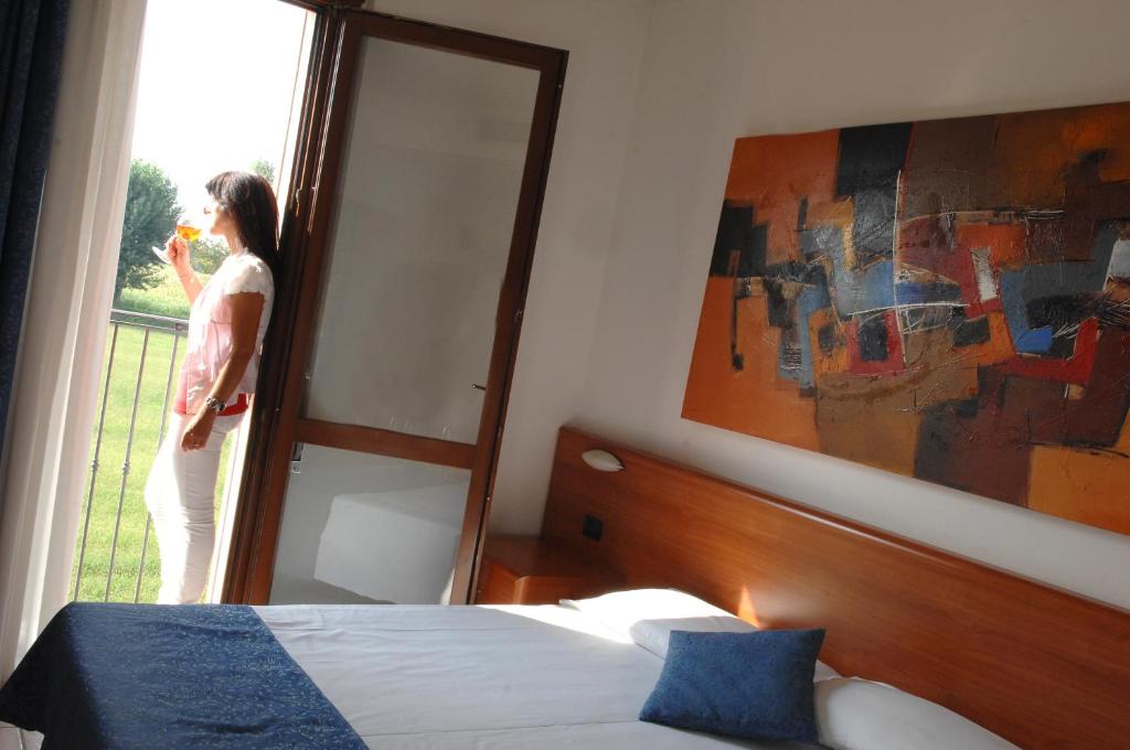 Postel nebo postele na pokoji v ubytování Hotel Scaldaferro