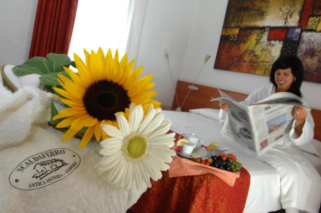 Postel nebo postele na pokoji v ubytování Hotel Scaldaferro
