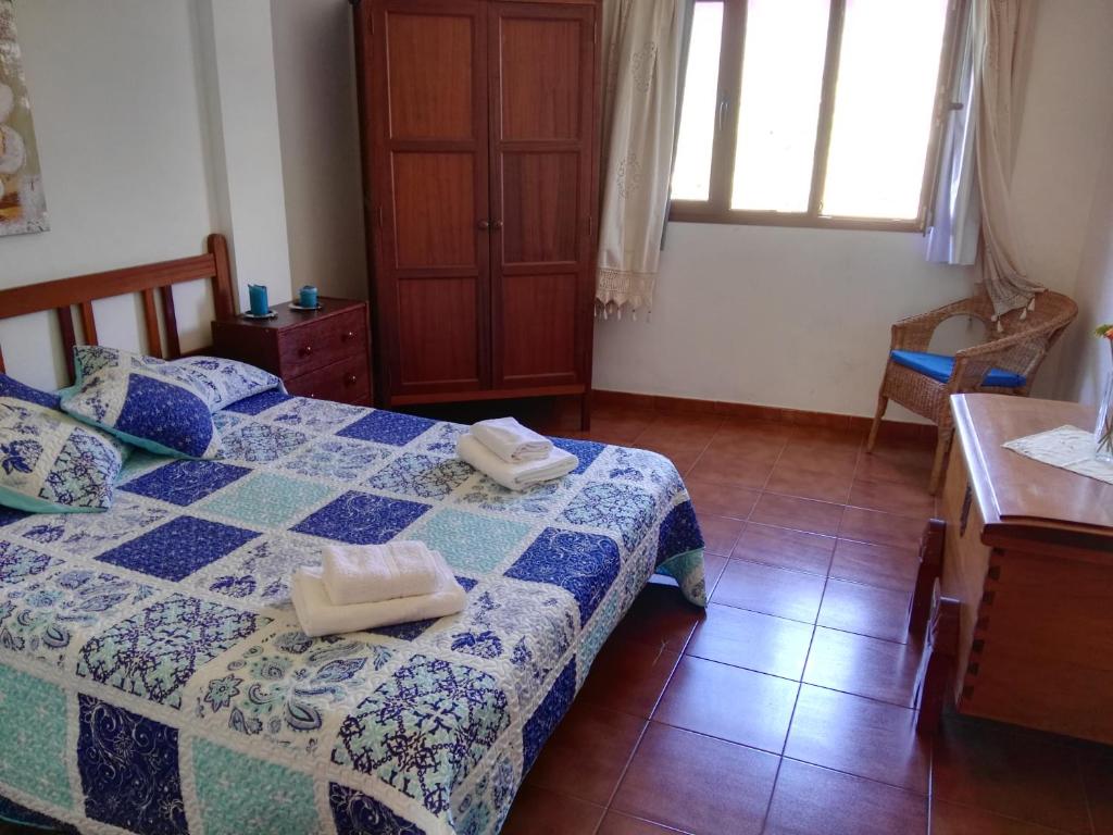 Postel nebo postele na pokoji v ubytování Alojamientos Nicasio