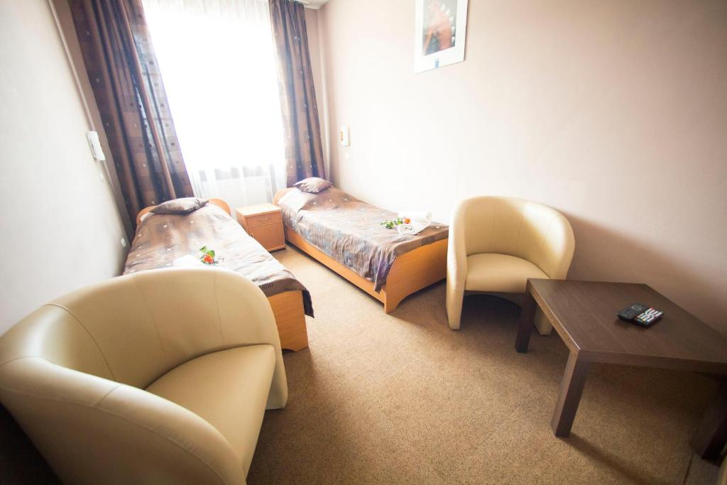 Postel nebo postele na pokoji v ubytování Hotel Roko