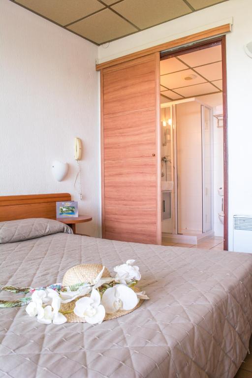 Postel nebo postele na pokoji v ubytování Hotel Roc E Mare