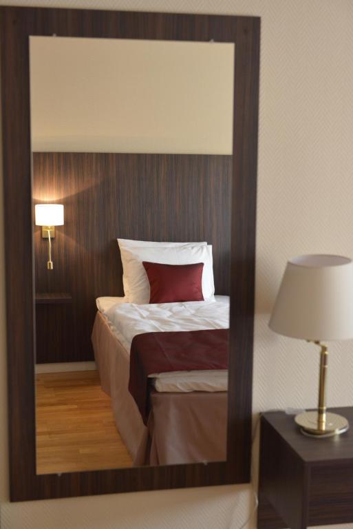 Postel nebo postele na pokoji v ubytování Hotell Nova