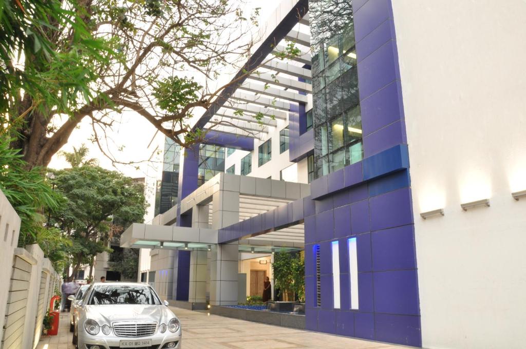 a car parked in front of a building at Adarsh Hamilton in Bangalore