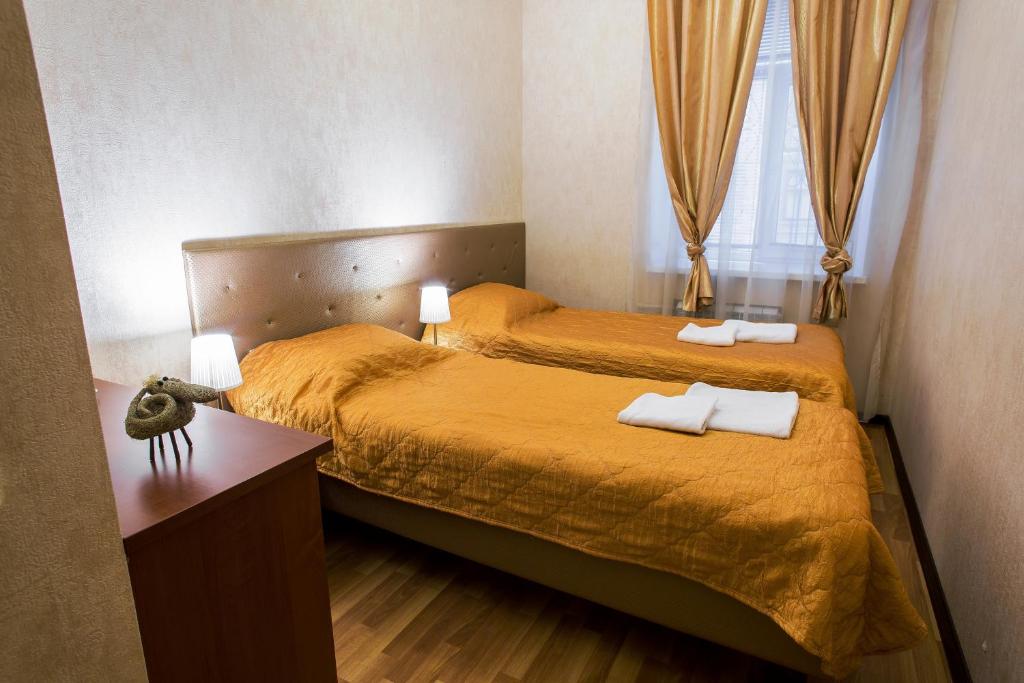 Postel nebo postele na pokoji v ubytování Golden Fleece Guest House