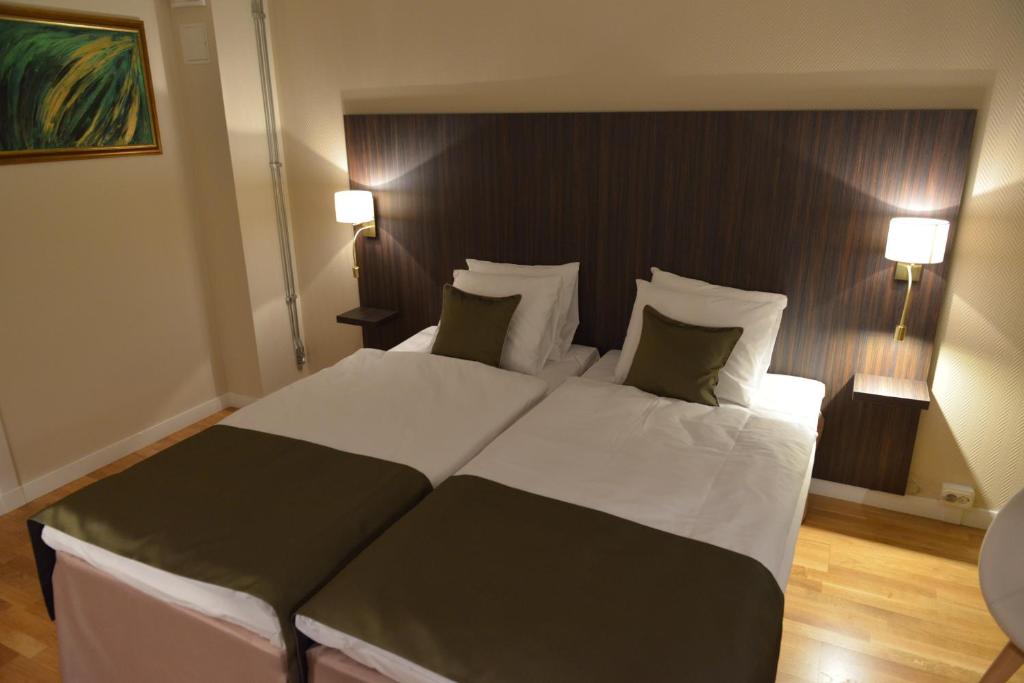 Postel nebo postele na pokoji v ubytování Hotell Nova