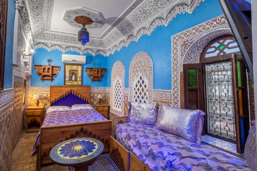 Postel nebo postele na pokoji v ubytování Riad Hiba