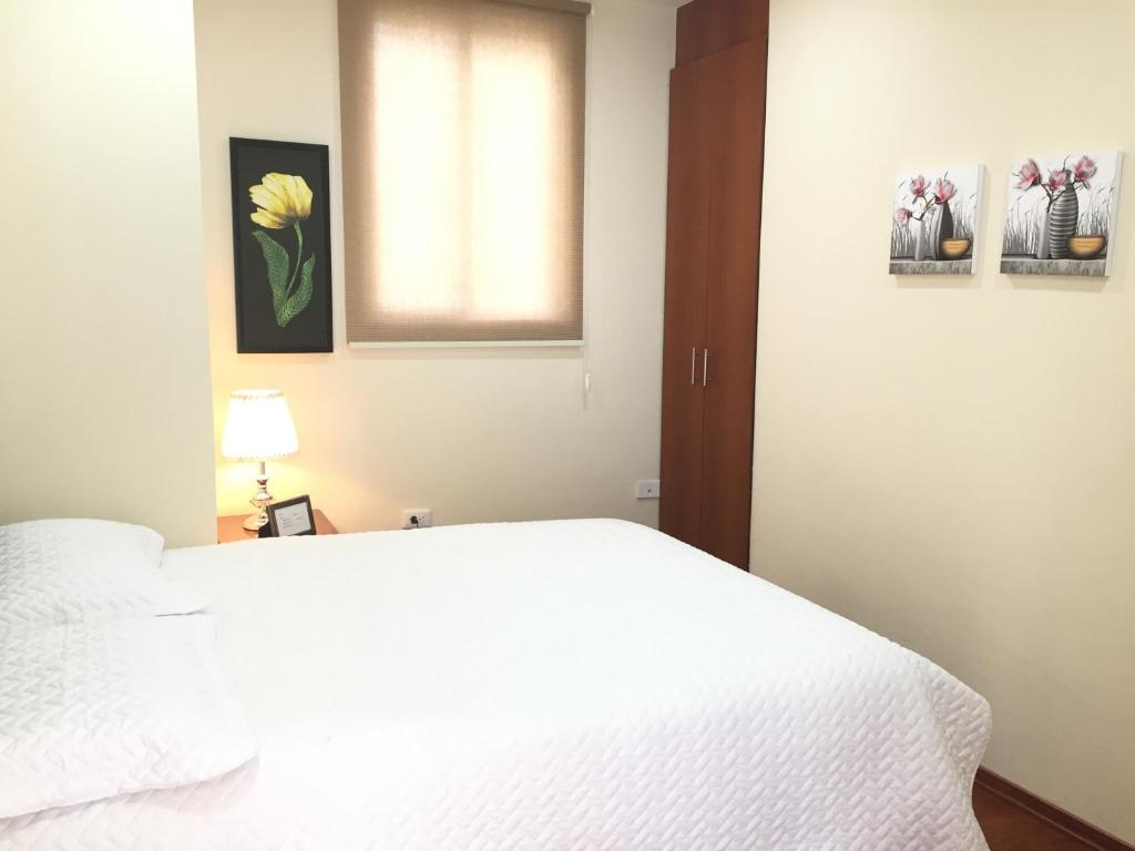 Postel nebo postele na pokoji v ubytování Quito Terrace