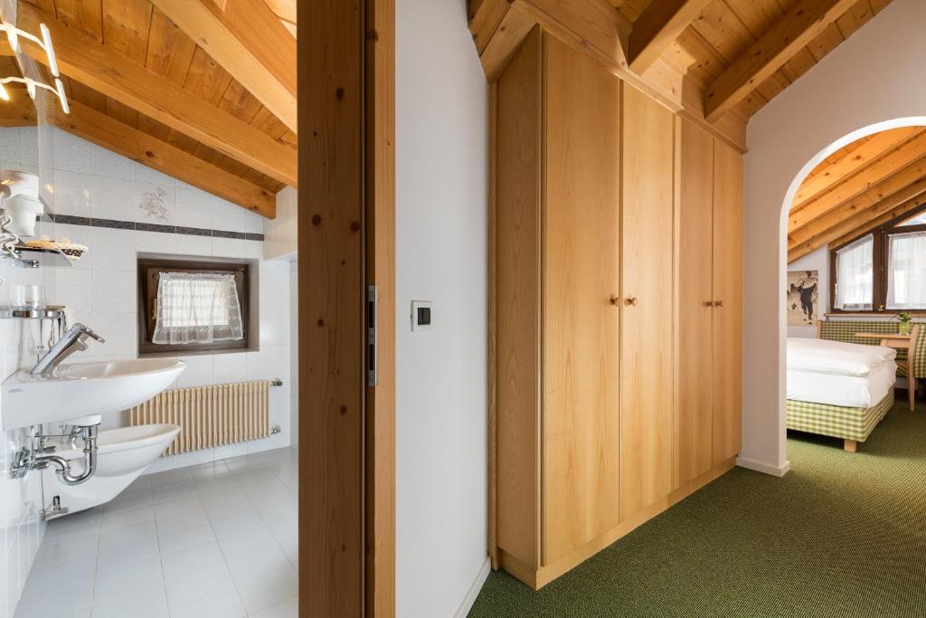Postel nebo postele na pokoji v ubytování Hotel Christian