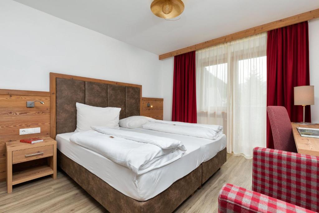 Postel nebo postele na pokoji v ubytování Hotel Christian
