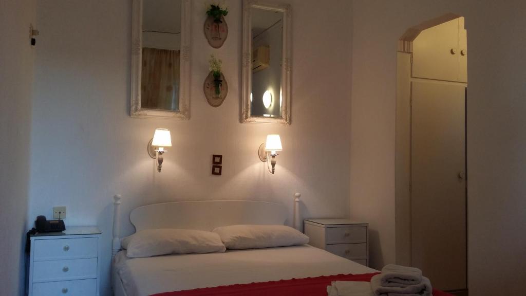 Postel nebo postele na pokoji v ubytování Rachel Hotel