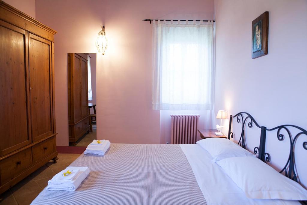 Cama ou camas em um quarto em Re Artù Assisi Country Lifestyle