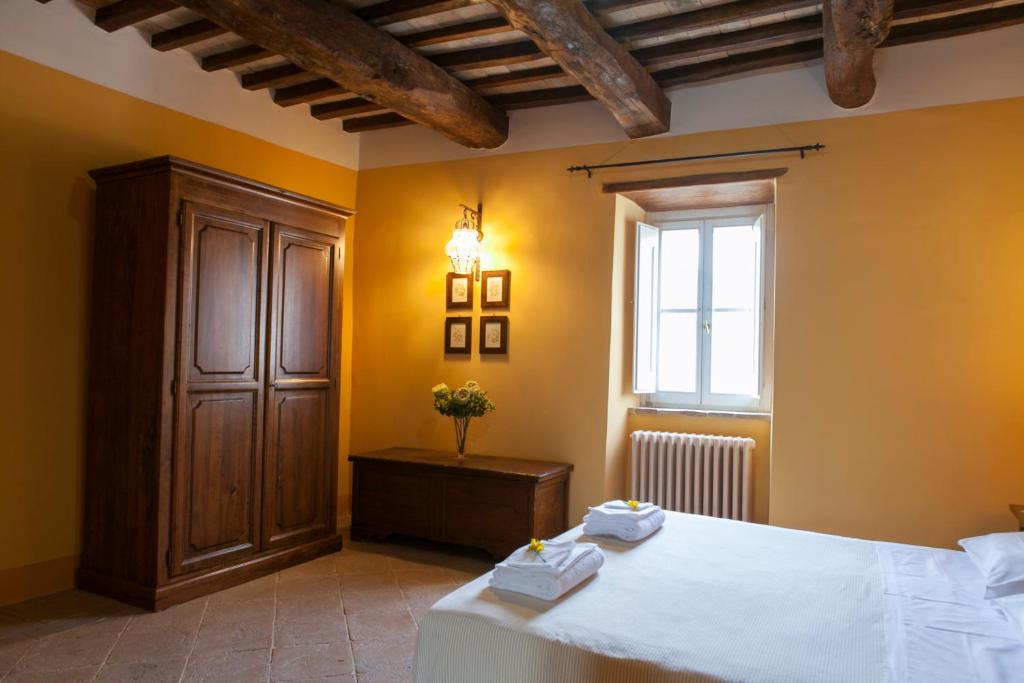Cama ou camas em um quarto em Re Artù Assisi Country Lifestyle