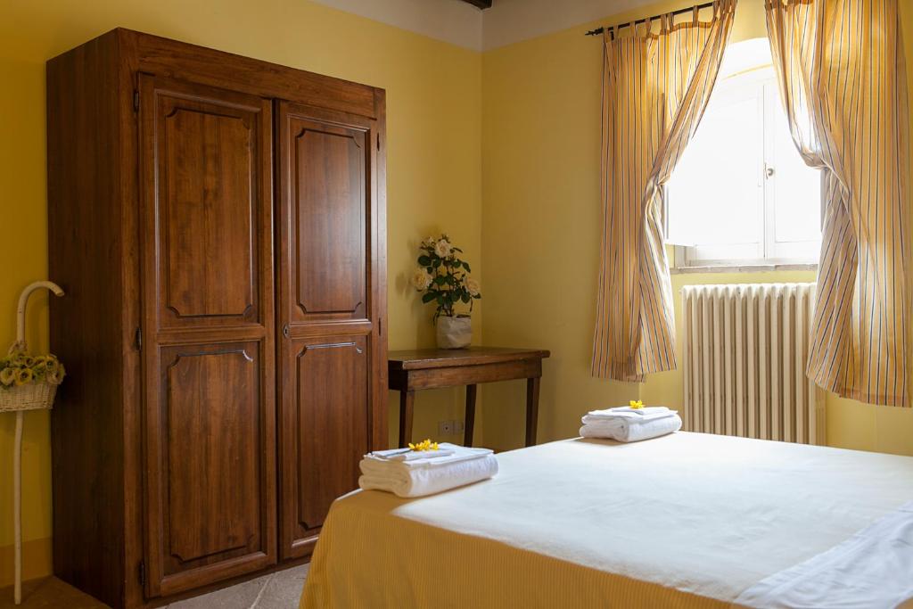 Cama ou camas em um quarto em Re Artù Assisi Country Lifestyle