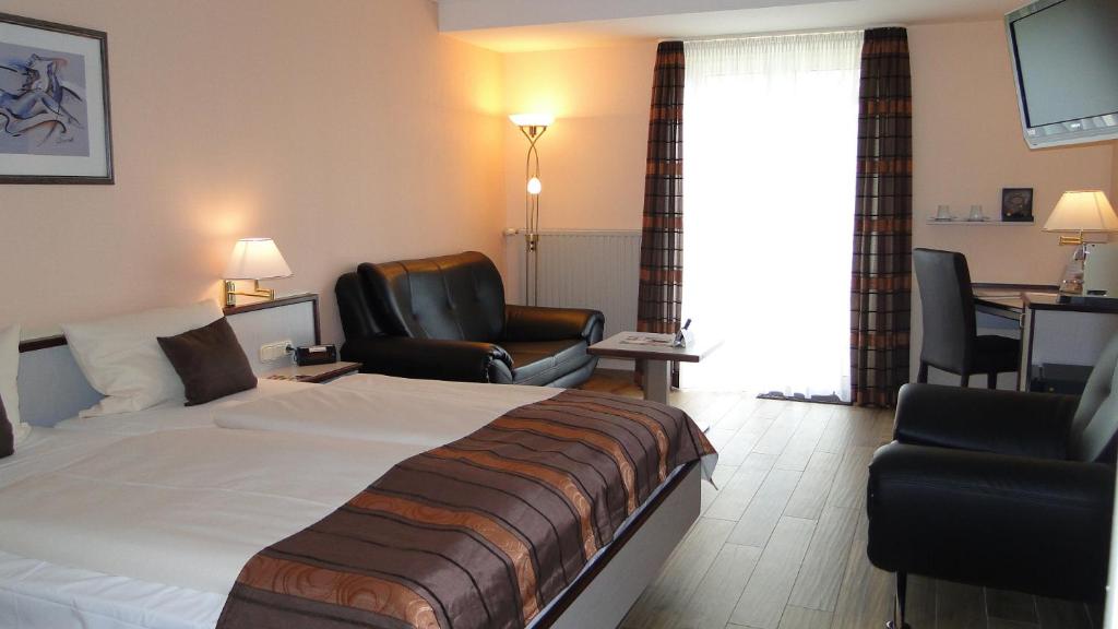Postel nebo postele na pokoji v ubytování Hotel Rhöner Land Garni - Bed & Breakfast