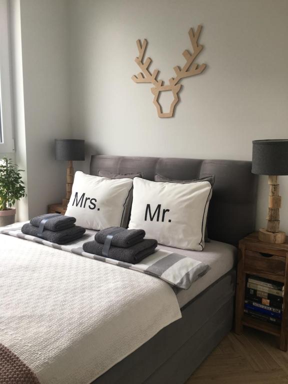 Кровать или кровати в номере Apartament Kolska