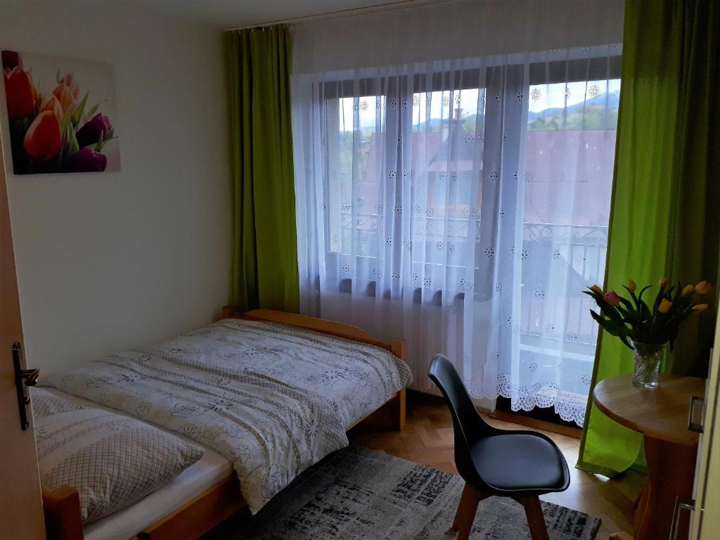 Posteľ alebo postele v izbe v ubytovaní Willa Widokowa Zakopane