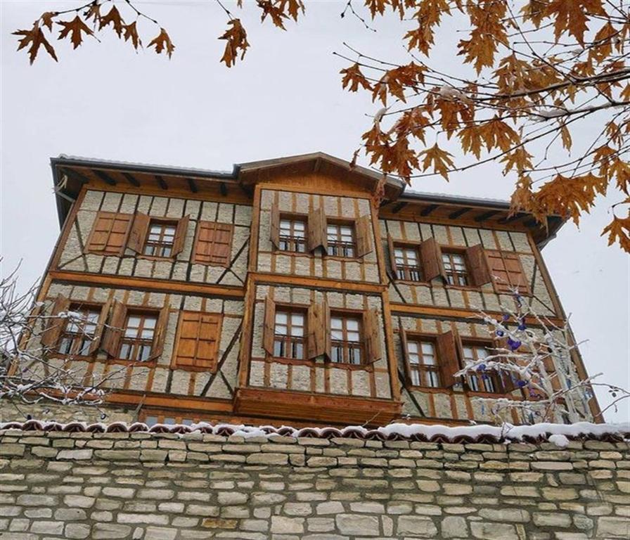 a large building on top of a stone wall at Dadibra Konak Hotel in Safranbolu