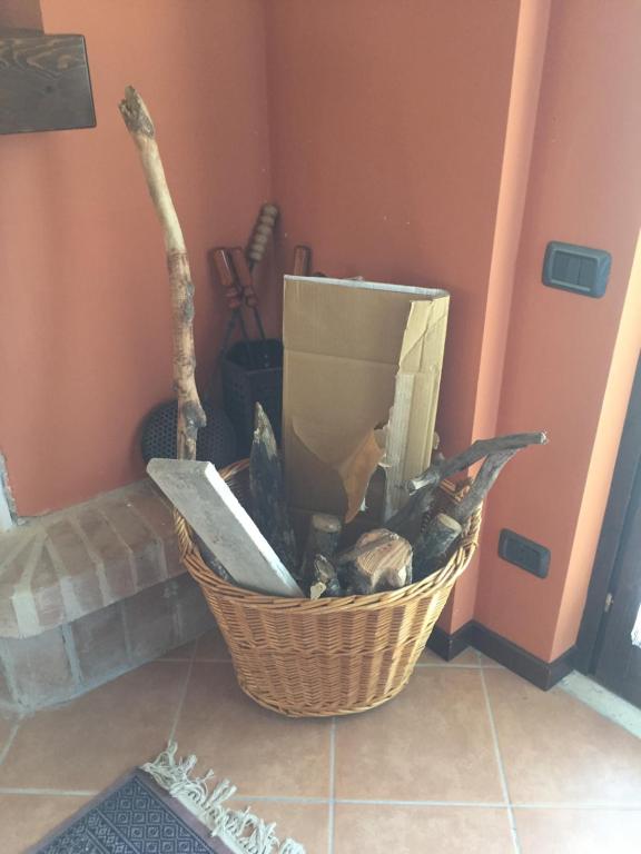 a basket full of food sitting on a floor at La Petite Maison in Ateleta