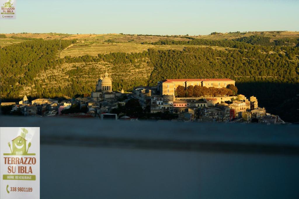 an aerial view of a city with a building at Terrazzo su Ibla in Ragusa
