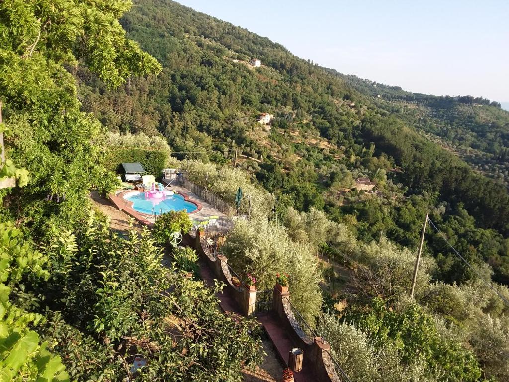 an aerial view of a swimming pool in a mountain at Holiday Home Bel Panorama Due in Pelago