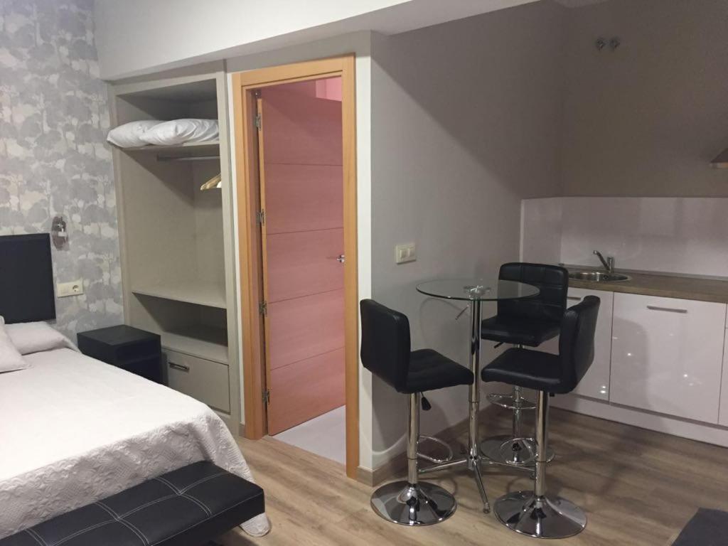 Postel nebo postele na pokoji v ubytování Apartamentos Mitreo