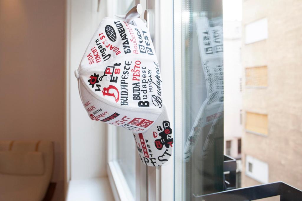 a bag of food hanging from a window at Anastasia 2 bedrooms apartment on Váci utca in Budapest