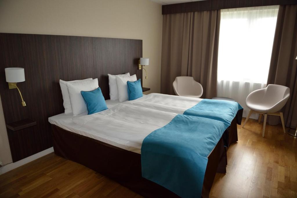 Postel nebo postele na pokoji v ubytování Hotell Nova